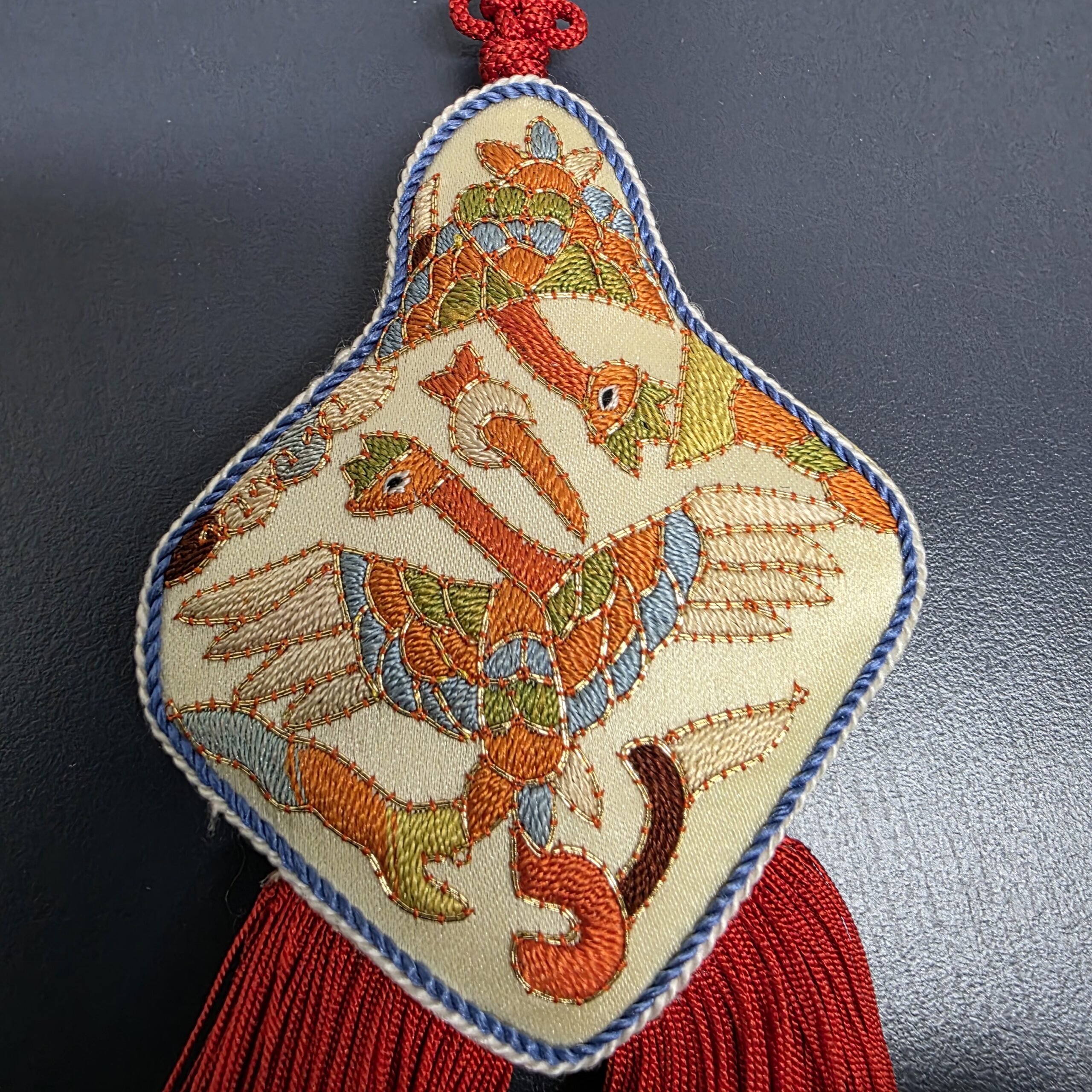 Close-up of crane embroidery on vintage Korean norigae