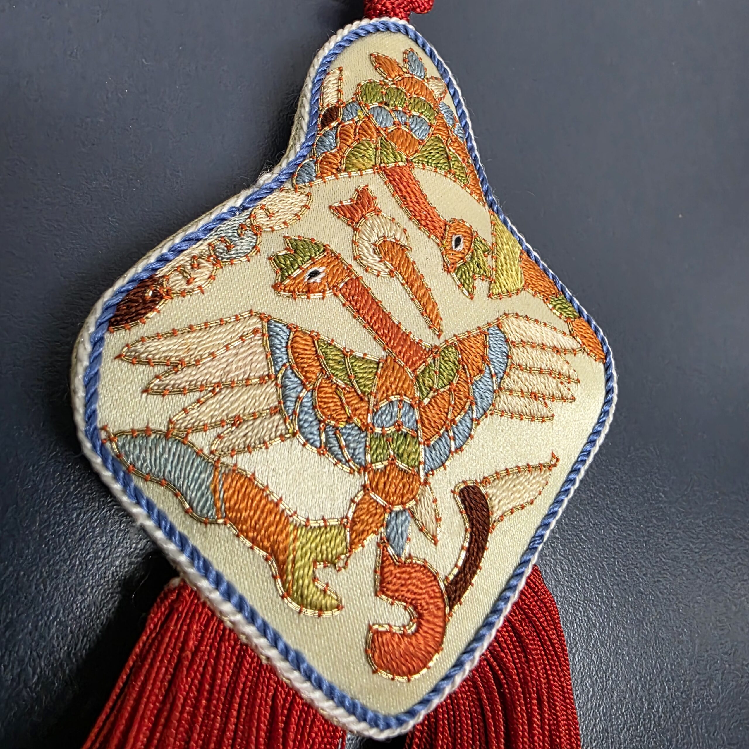 Detailed hand embroidery on Korean crane motif norigae