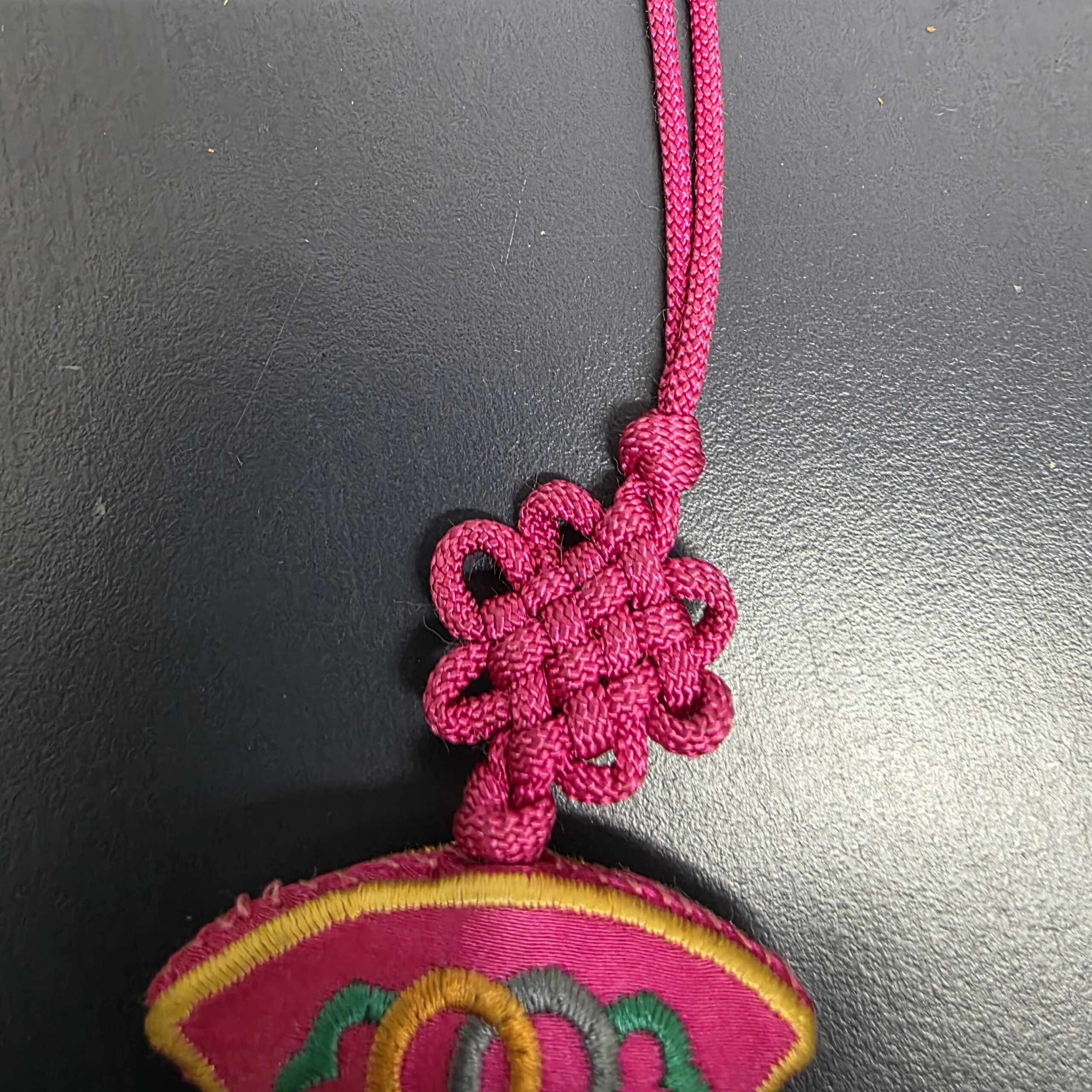 Traditional decorative knot above embroidered Korean norigae centerpiece