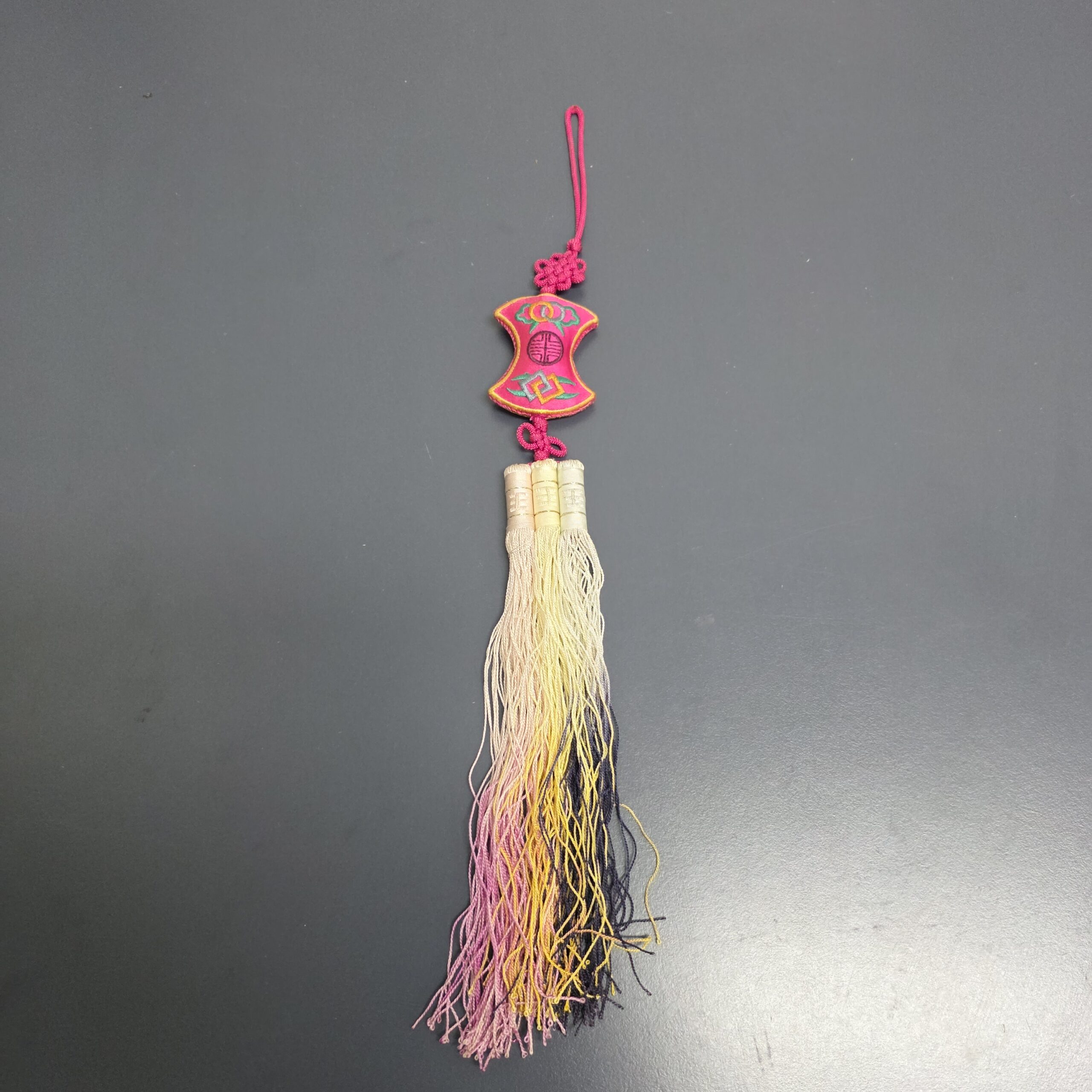 Full view of handcrafted Korean embroidered knot norigae with multicolor tassels